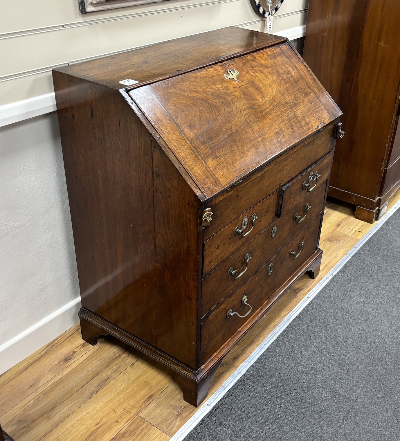 A George III red walnut bureau, width 84cm, depth 51cm, height 95cm